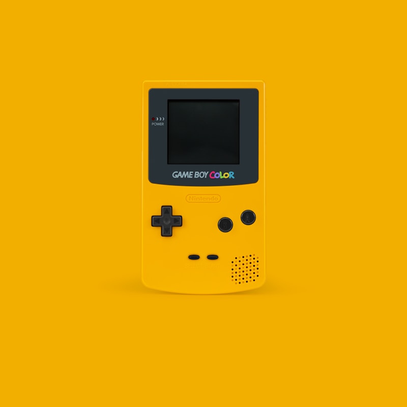 Yellow Nintendo Game Boy Color on a yellow surface