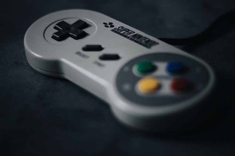 Close-up of Super Nintendo controller buttons — A, B, X, Y, Start, Select