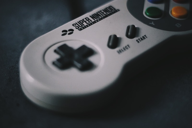Close-up of a Super Nintendo Entertainment System controller on a dark background